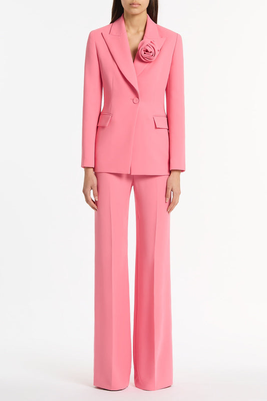 Image of a model wearing Pants. Product name - Rose Pink Crepe Classic Flared Pant in Pink colour by brand - Carla Zampatti