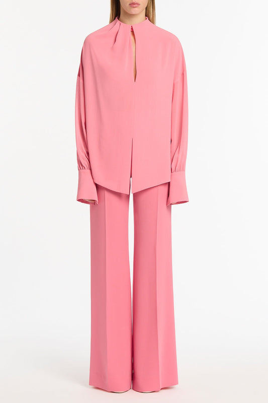 Image of a model wearing Tops. Product name - Rose Pink Georgette Drop Sleeve Blouse in Pink colour by brand - Carla Zampatti