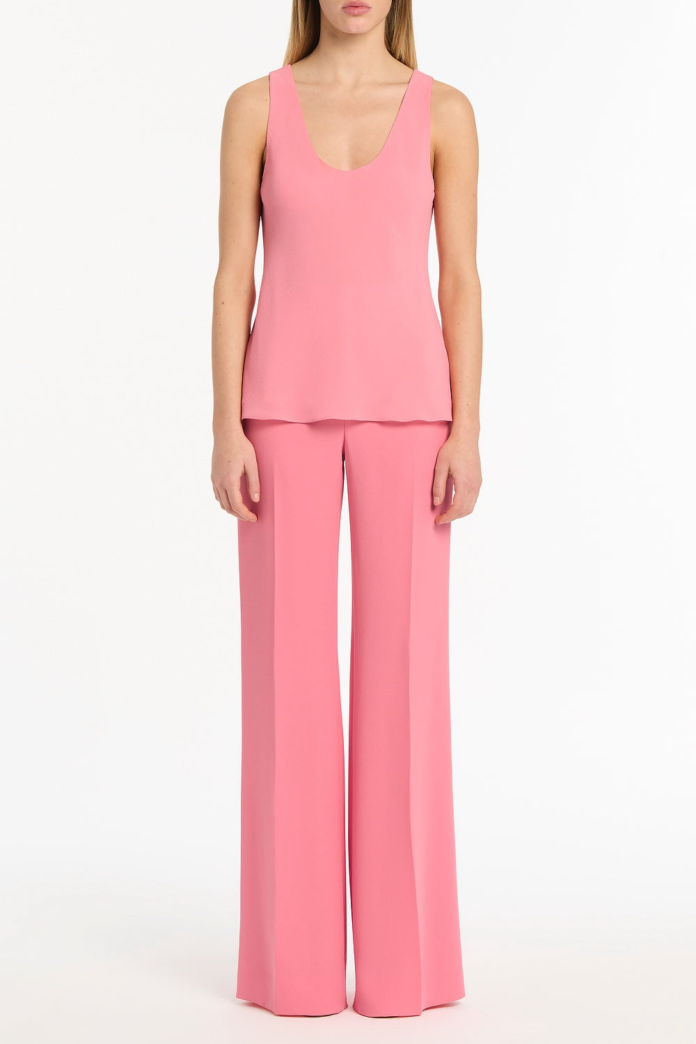 Image of a model wearing Tops. Product name - Rose Pink Georgette Scoop Neck Cami in Pink colour by brand - Carla Zampatti