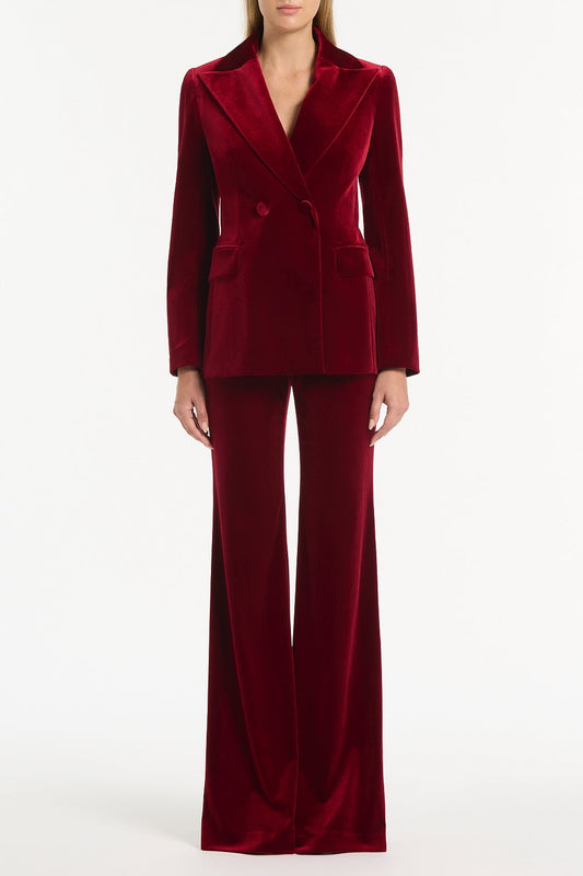 Image of a model wearing Pants. Product name - Rouge Velvet Wide Leg Pant in Red colour by brand - Carla Zampatti