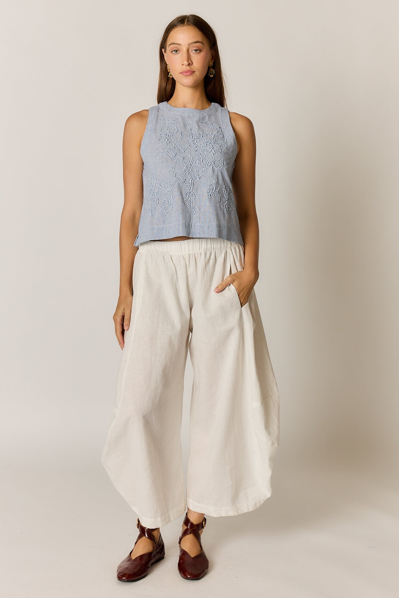 Image of a model wearing Tops. Product name - Rubyyaya Cornelli Stripe Top Blue in Blue colour by brand - Rubyyaya