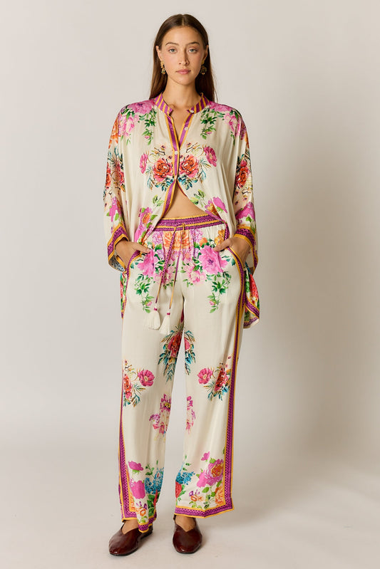 Image of a model wearing Pants. Product name - PRE SALE | Rubyyaya Liberte Pant Cream in Cream colour by brand - Rubyyaya