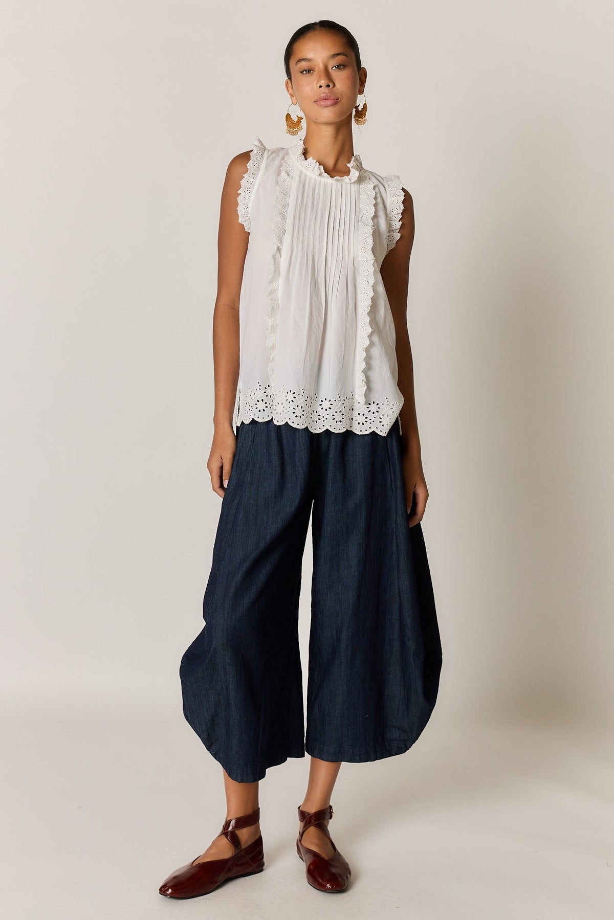 Image of a model wearing Tops. Product name - Rubyyaya Matilda Top White in White colour by brand - Rubyyaya