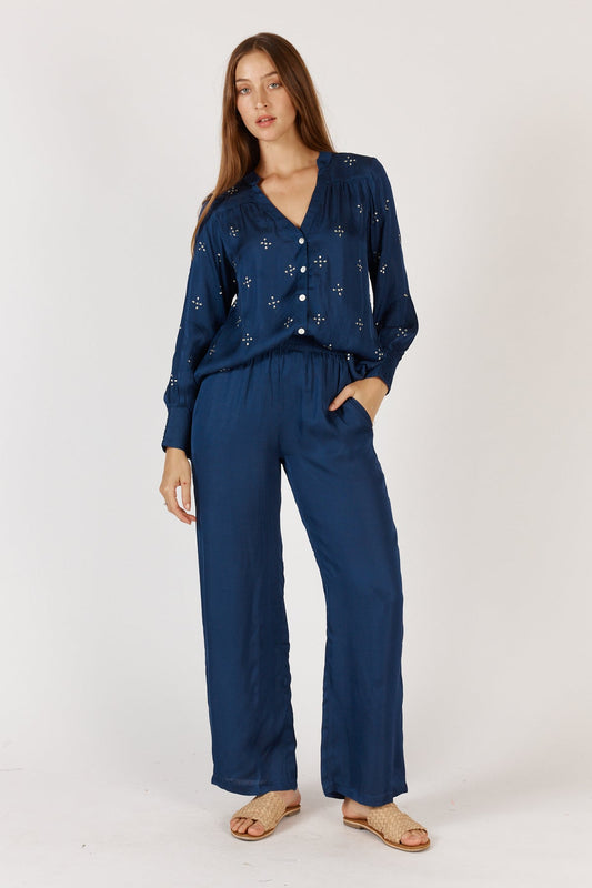 Image of a model wearing Pants. Product name - Rubyyaya Munchen Pant Navy in Navy colour by brand - Rubyyaya