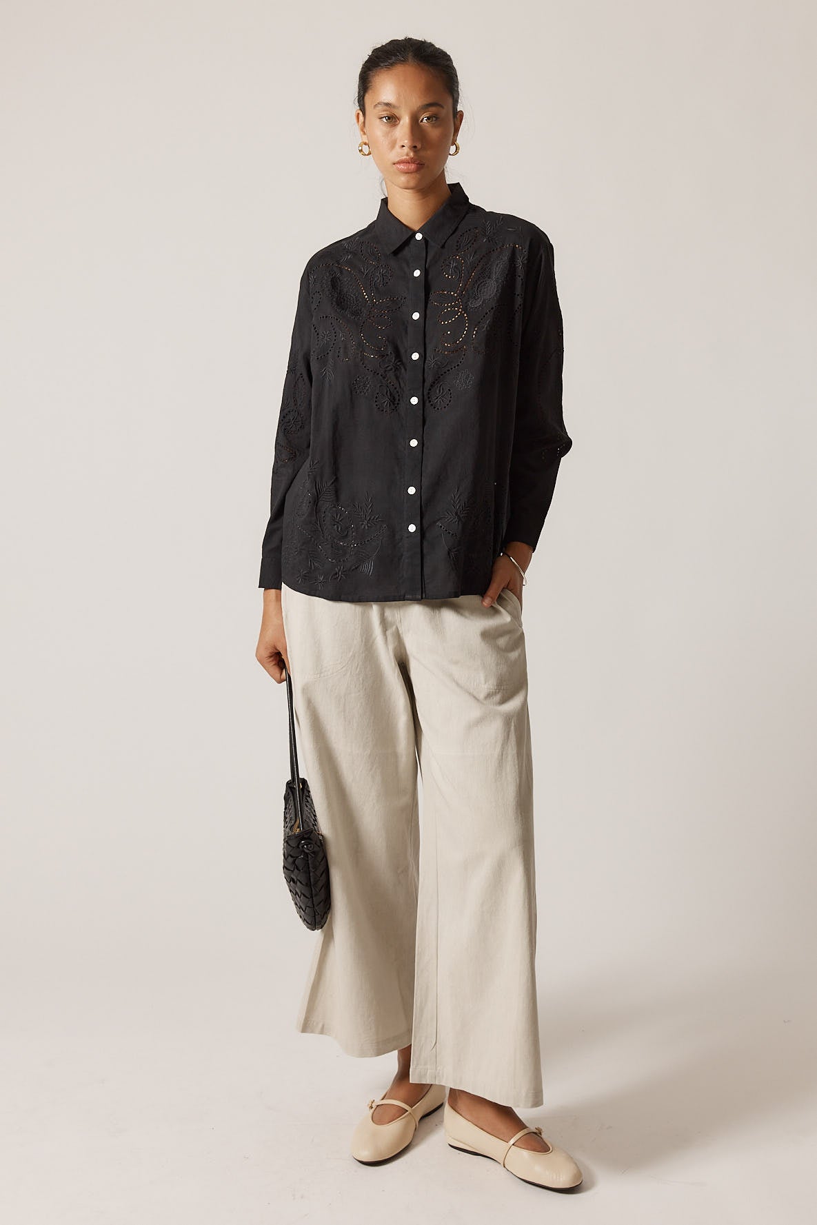 Image of a model wearing Pants. Product name - Rubyyaya Pula Pant Natural in Natural colour by brand - Rubyyaya