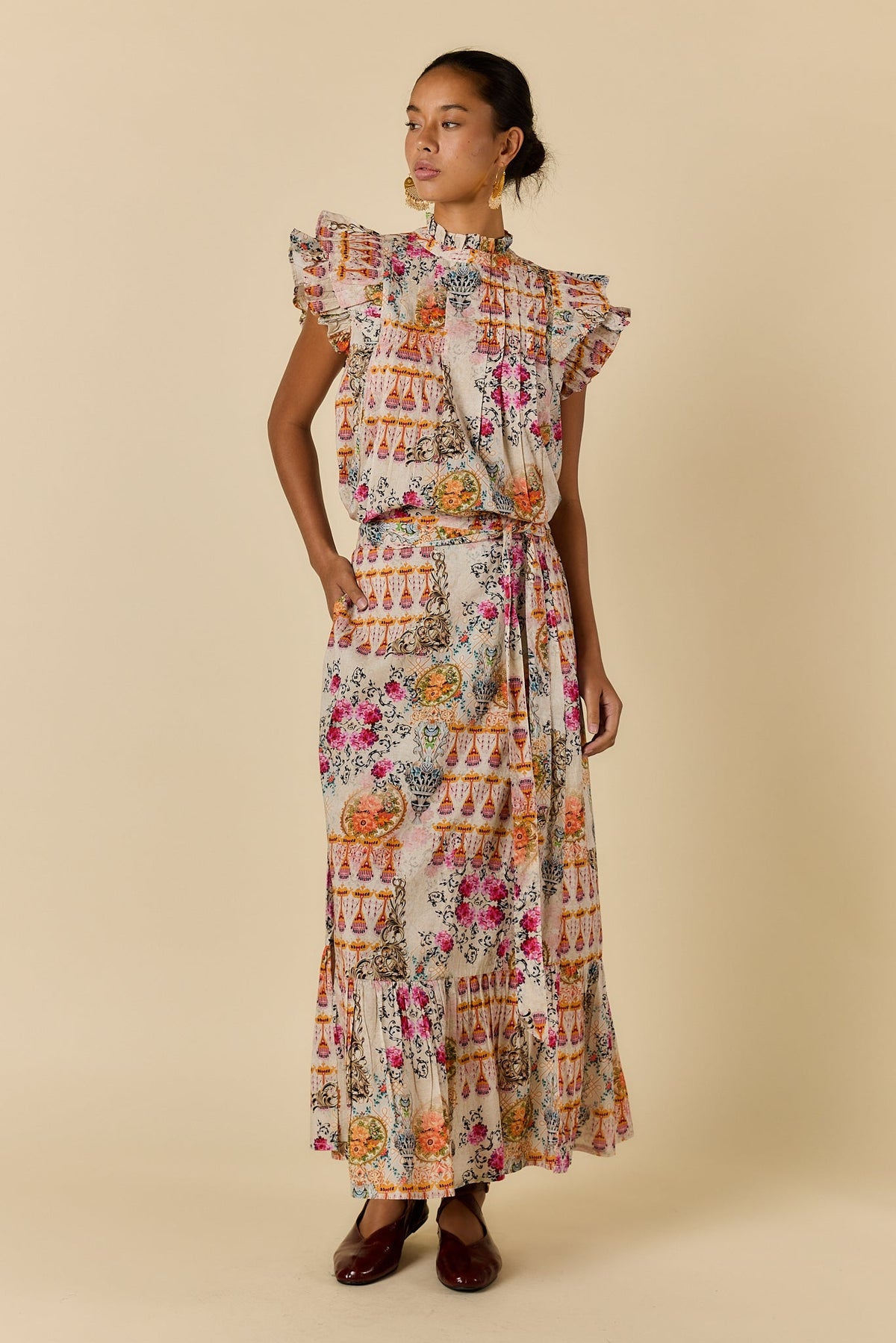 Image of a model wearing Skirts. Product name - Rubyyaya Rosetta Skirt Gold in Gold colour by brand - Rubyyaya