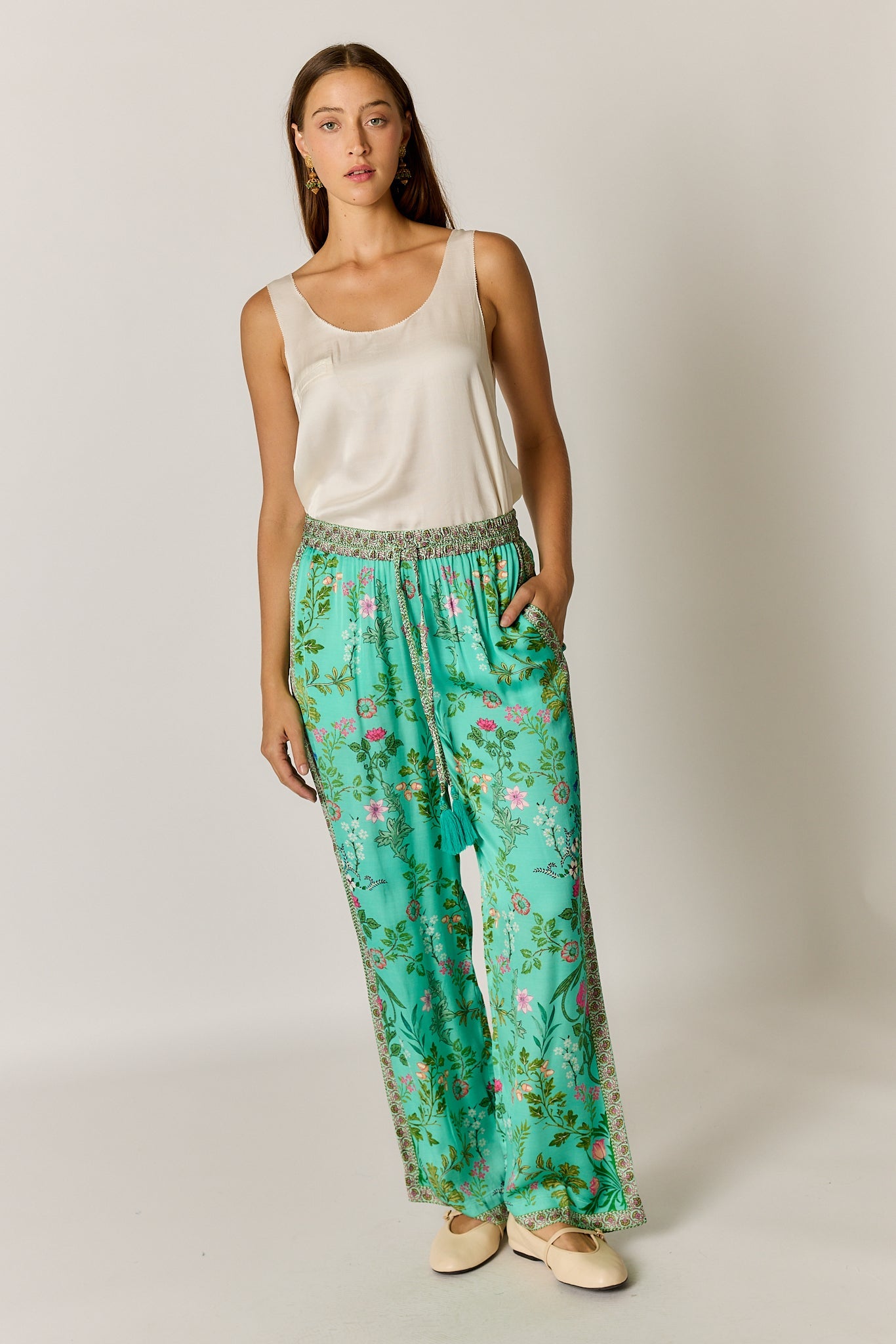 Image of a model wearing Pants. Product name - PRE SALE | Rubyyaya Tatiana Pant Green in Green colour by brand - Rubyyaya