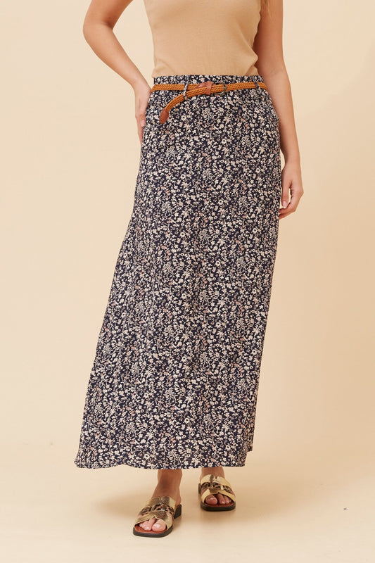 Image of a model wearing Skirts. Product name - BETTY DITSY PRINT MAXI SKIRT in Navy colour by brand - Caroline Morgan Australia