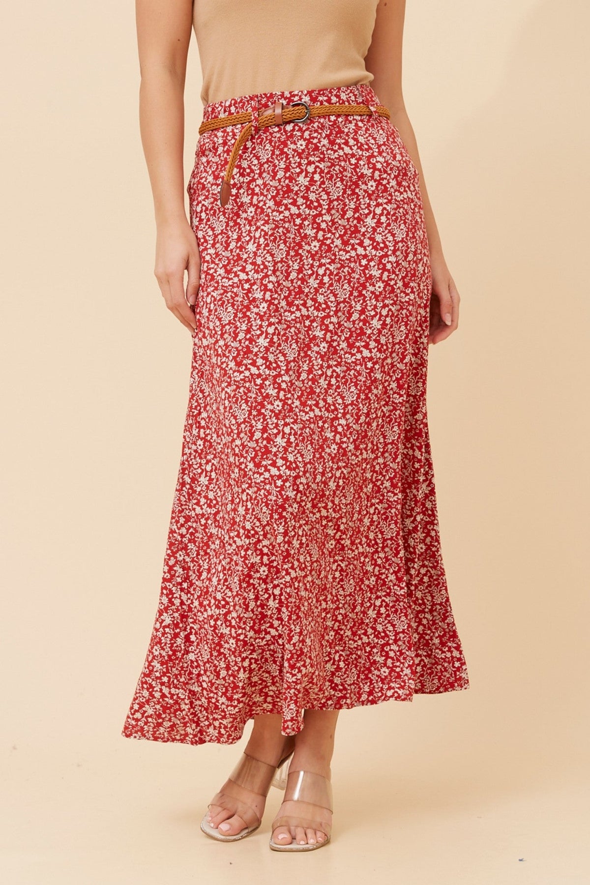 Image of a model wearing Skirts. Product name - BETTY DITSY PRINT MAXI SKIRT in Red colour by brand - Caroline Morgan Australia