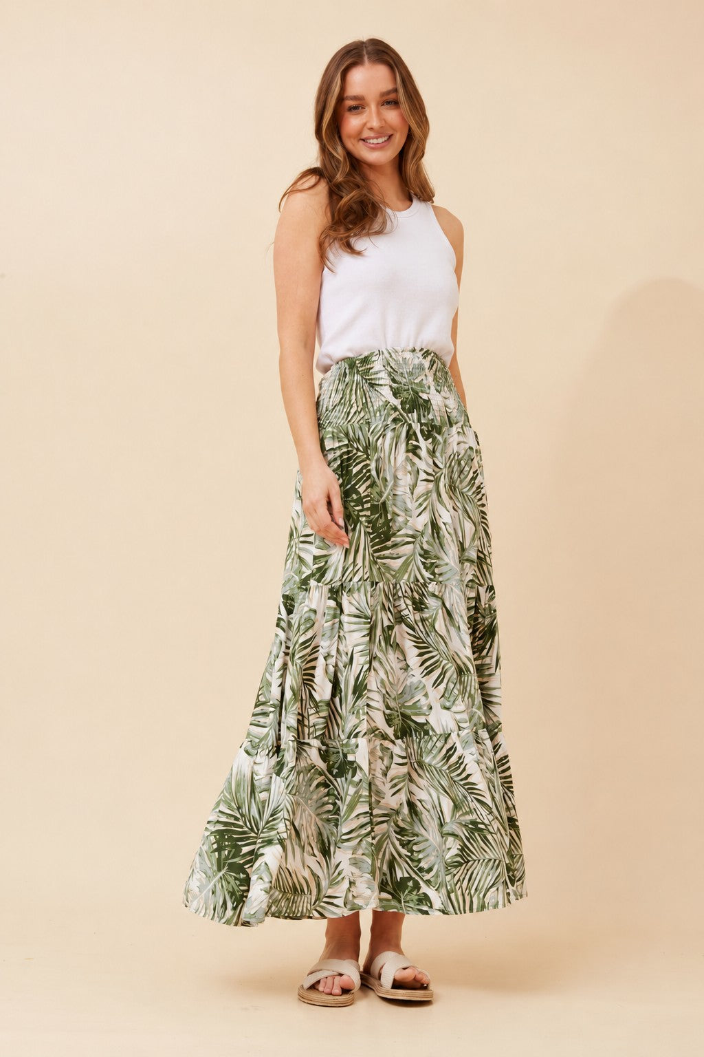Image of a model wearing Skirts. Product name - BETTINA LEAF PRINT MAXI SKIRT in Green colour by brand - Caroline Morgan Australia