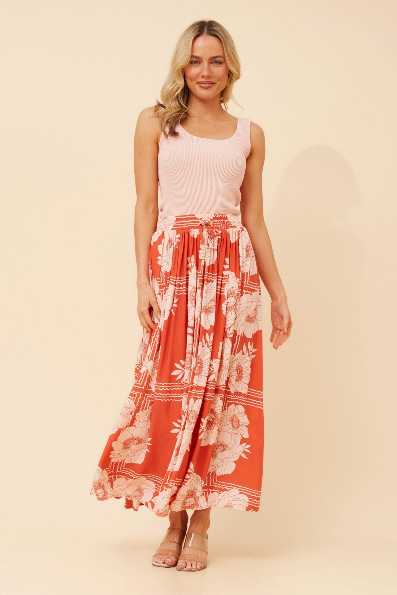 Image of a model wearing Skirts. Product name - TEE LINEN BLEND MAXI SKIRT in Desert Orange colour by brand - Caroline Morgan Australia