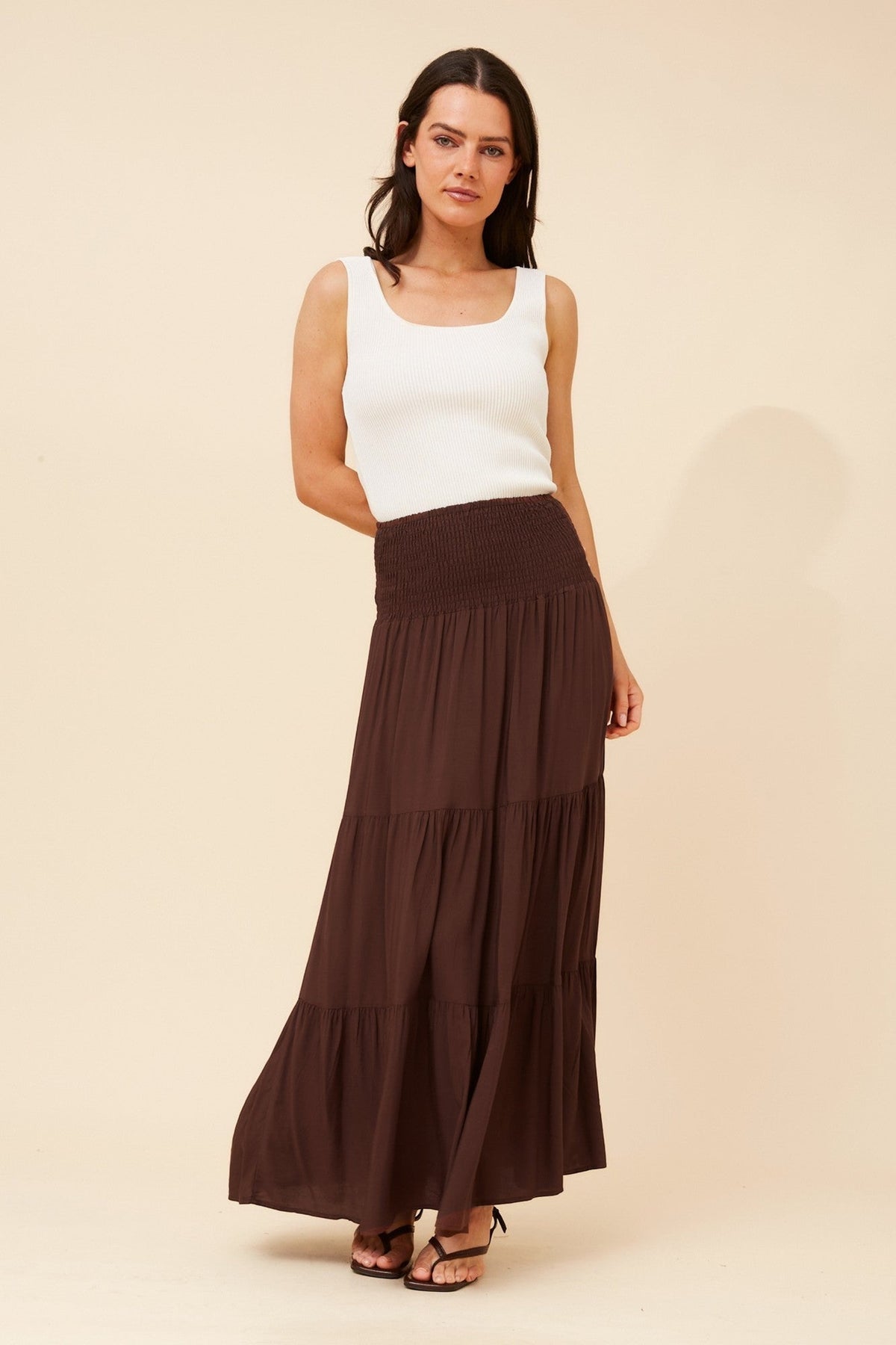 Image of a model wearing Skirts. Product name - BETTINA SOLID MAXI SKIRT in Black colour by brand - Caroline Morgan Australia