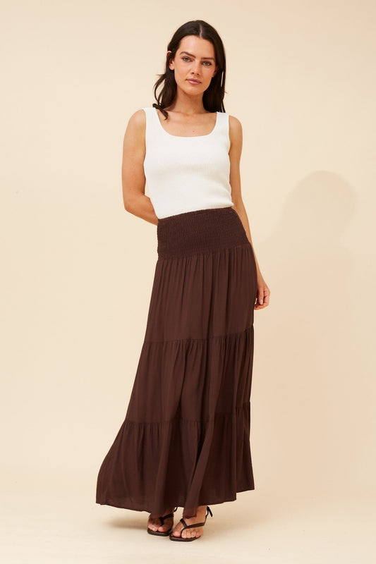 Image of a model wearing Skirts. Product name - BETTINA SOLID MAXI SKIRT in Black colour by brand - Caroline Morgan Australia