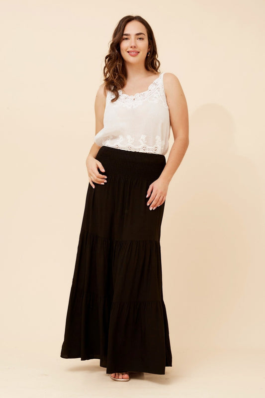 Image of a model wearing Skirts. Product name - BETTINA SOLID MAXI SKIRT in Black colour by brand - Caroline Morgan Australia