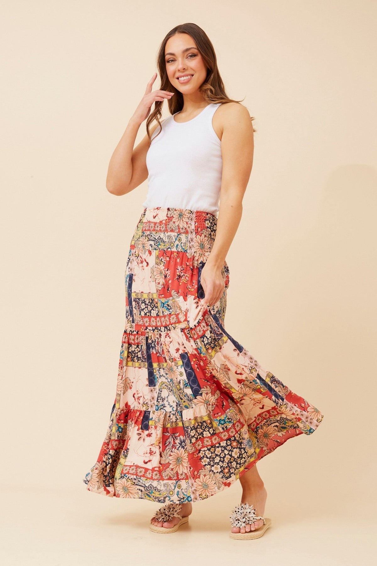 Image of a model wearing Skirts. Product name - BETTINA BOHO MAXI SKIRT in Coral colour by brand - Caroline Morgan Australia