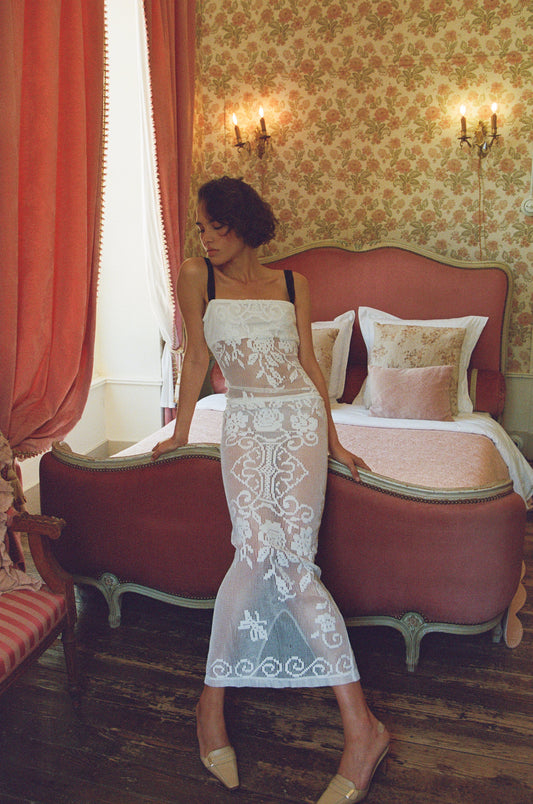 Image of a model wearing Skirts. Product name - Saint Midi Skirt in White colour by brand - With Jéan