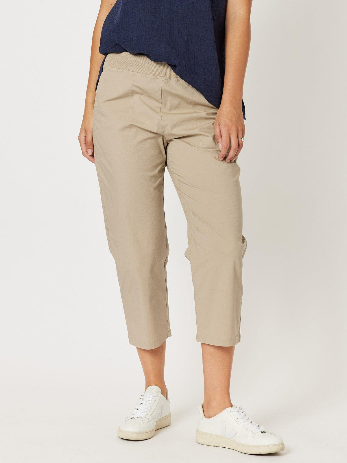 Image of a model wearing Pants. Product name - Santorini Cotton Capri Pant Natural in Natural colour by brand - Threadz