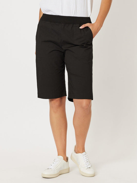 Image of a model wearing Shorts. Product name - Santorini Cotton Pull On Short Black in Black colour by brand - Threadz