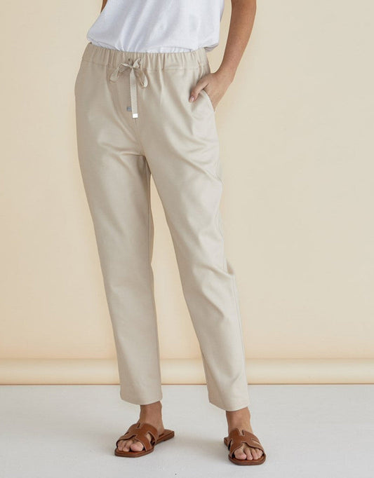 Image of a model wearing Pants. Productname: Kenzie Jogger - in Cream colour by brand - Betty Basics