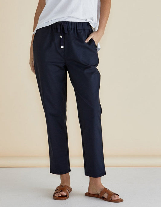 Image of a model wearing Pants. Productname: Kenzie Jogger - in Navy colour by brand - Betty Basics