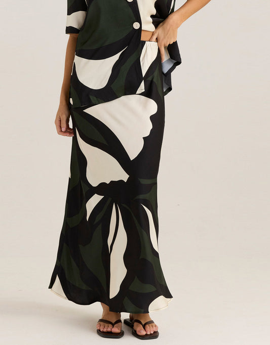 Image of a model wearing Skirts. Productname: Tarni Satin Slip Skirt - in Iris Abstract Print colour by brand - Sass Clothing