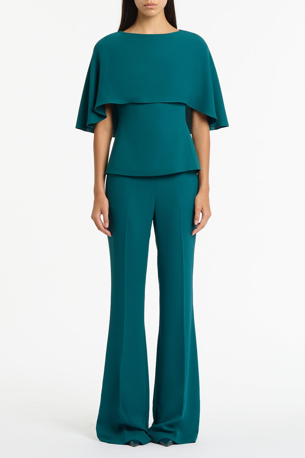 Image of a model wearing Tops. Product name - Serpentine Crepe Cape Top in Green colour by brand - Carla Zampatti