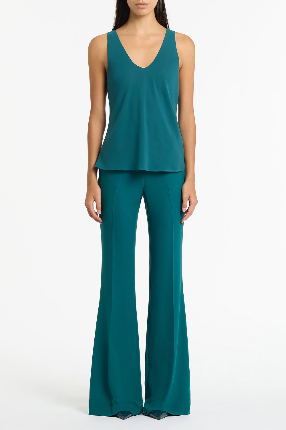 Image of a model wearing Tops. Product name - Serpentine Georgette Scoop Cami in Green colour by brand - Carla Zampatti