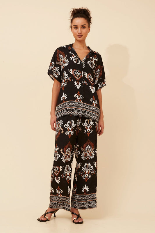 Image of Shirts. Product name - NEVELLE BORDER PRINT TWO-PIECE SET in Black colour by brand - Caroline Morgan Australia