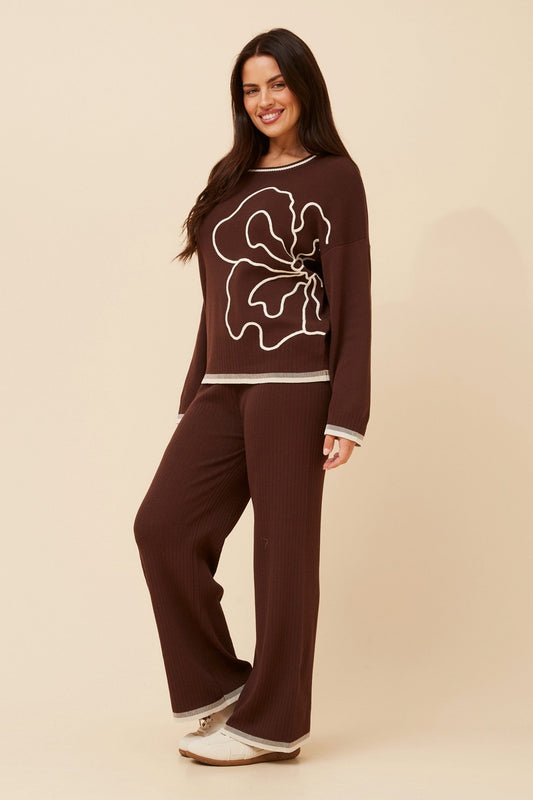 Image of a model wearing Tops. Product name - ERLINDA TWO-PIECE KNIT SET in Black colour by brand - Caroline Morgan Australia