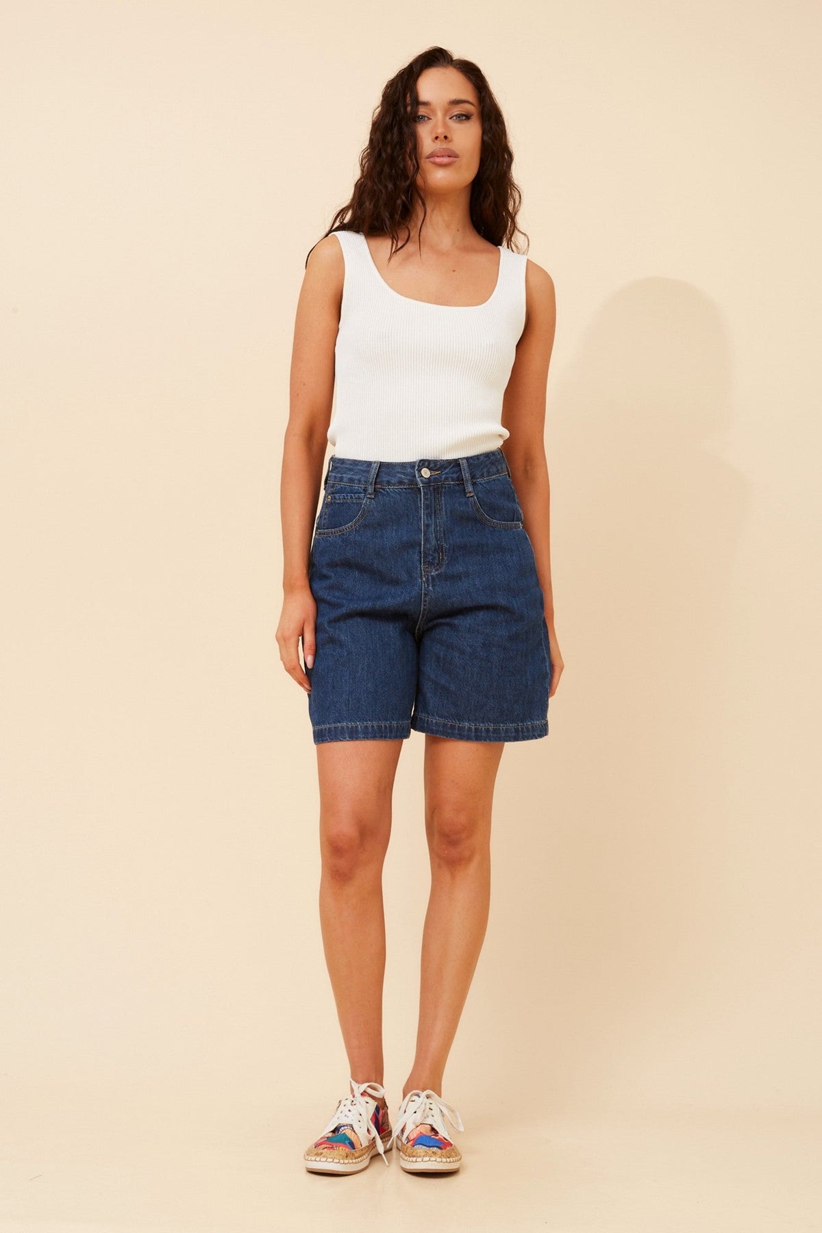 Image of a model wearing Shorts. Product name - QUINLEY DENIM SHORTS in Dark Denim colour by brand - INFINITY DENIM