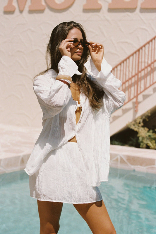 Image of a model wearing Skirts. Productname: SNDYS BRANDI MINI SKIRT in White colour by brand - SNDYS