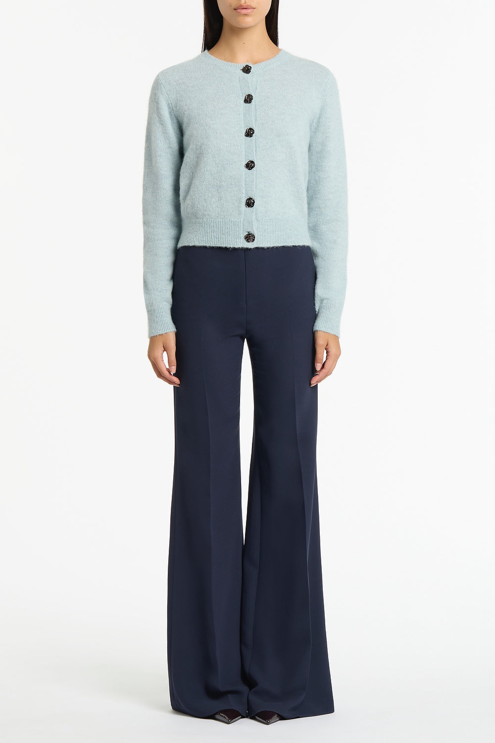 Image of a model wearing Outerwear. Product name - Snowbird Brushed Knit Cardigan in Blue colour by brand - Carla Zampatti