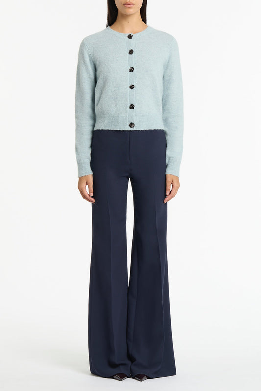 Image of a model wearing Outerwear. Product name - Snowbird Brushed Knit Cardigan in Blue colour by brand - Carla Zampatti