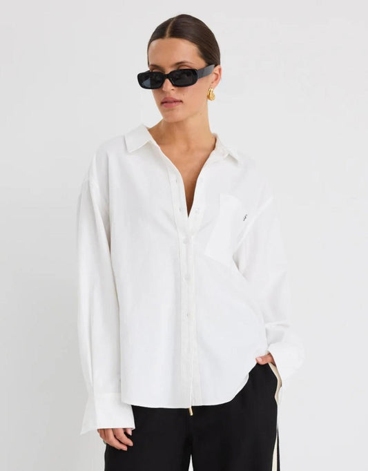 Image of a model wearing Tops. Productname: Signature Oxford Oversized Shirt - in Ivory colour by brand - Stories Be Told