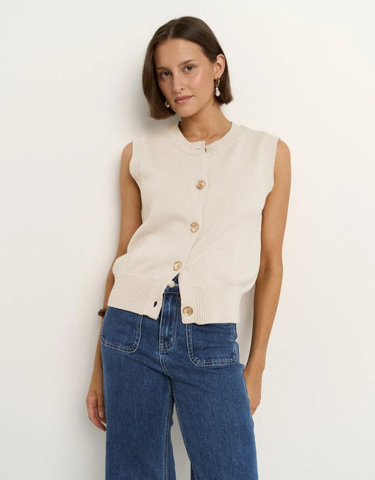 Image of a model wearing Outerwear. Productname: Trait Crewneck Knitted Vest Top - in Ivory colour by brand - Stories Be Told