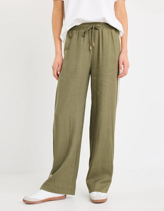 Image of a model wearing Pants. Productname: Vibe Jacquard Stripe Wide Leg Pants - in Khaki colour by brand - Stories Be Told