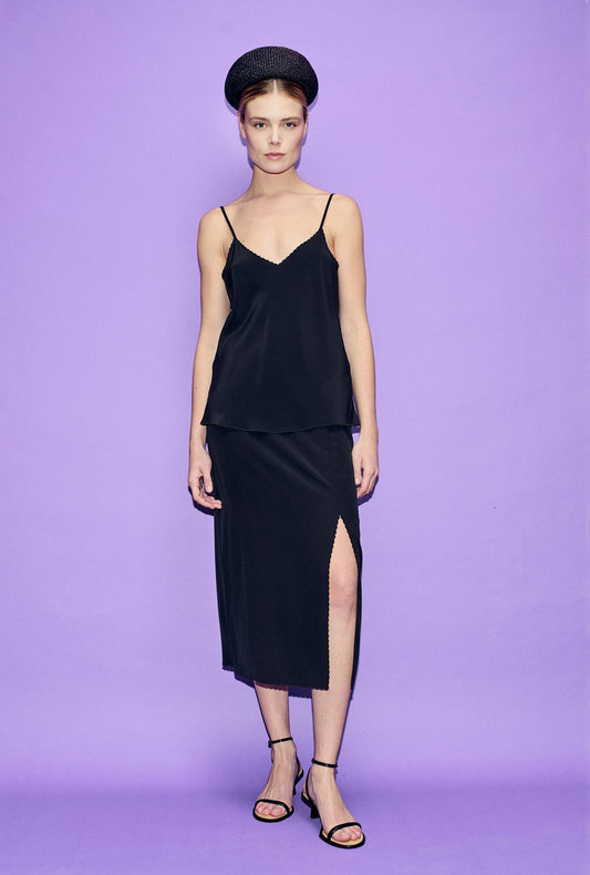 Image of a model wearing Tops. Product name - CDC Bias Cut Cami Black in Black colour by brand - Silk Laundry
