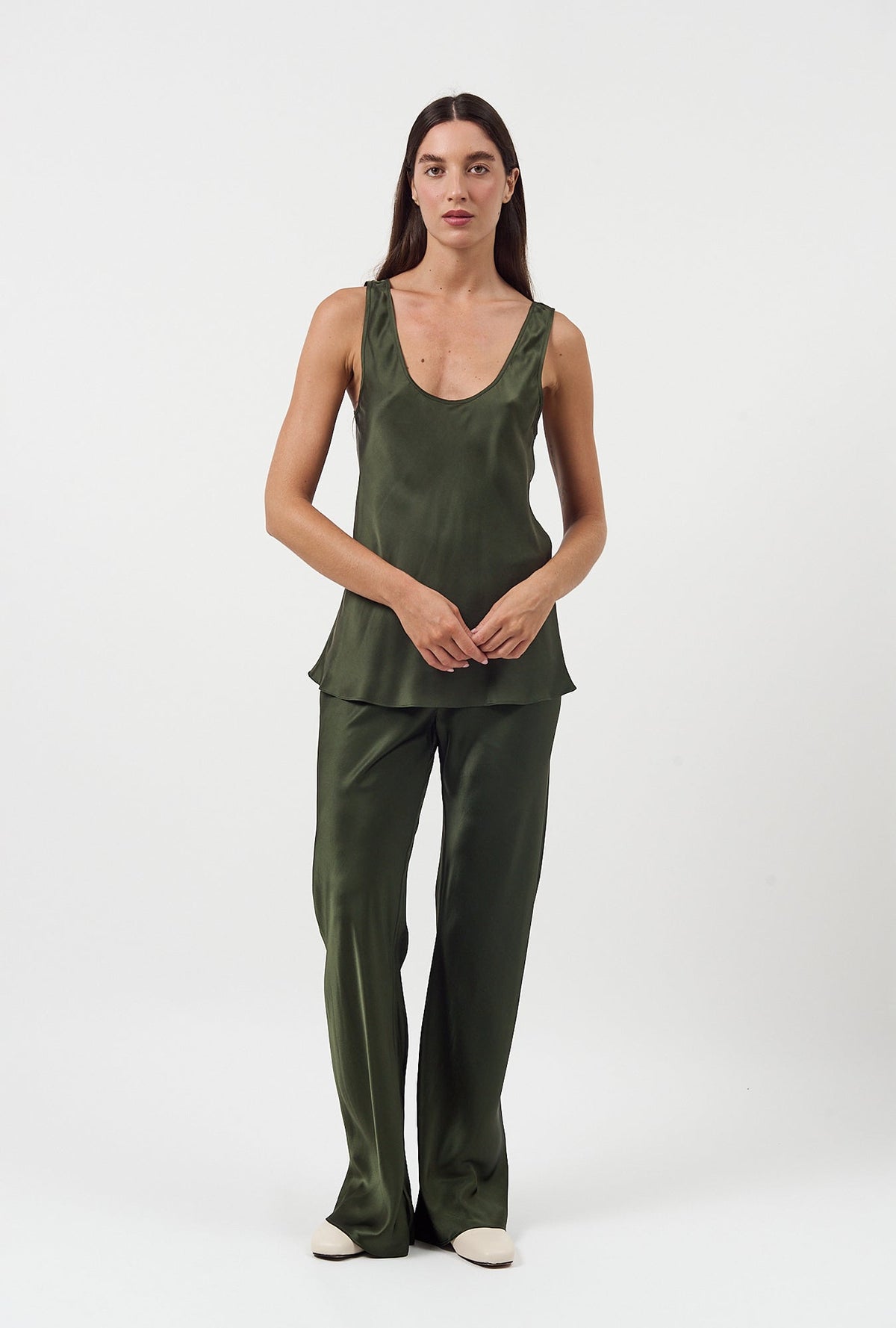 Image of a model wearing Pants. Product name - Bias Cut Pants Cedar in Cedar colour by brand - Silk Laundry