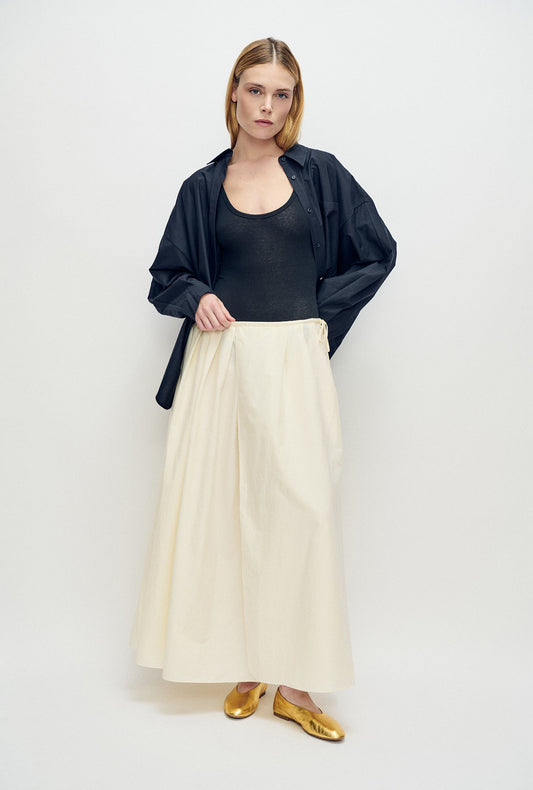 Image of a model wearing Skirts. Product name - Daisy Skirt Off-White in Off-White colour by brand - Silk Laundry