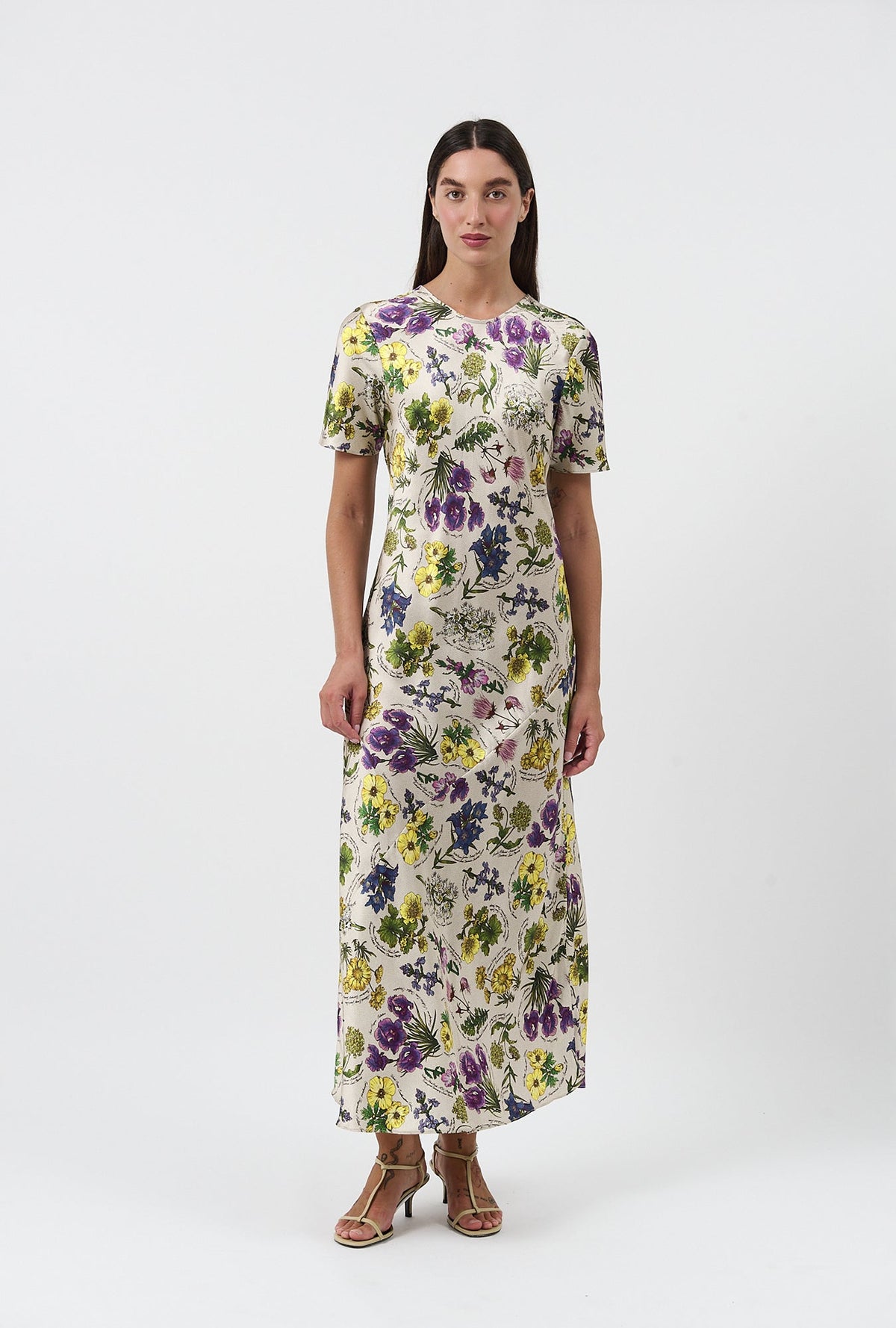 Image of a model wearing Tops. Product name - Short Sleeve Bias Cut Dress Endangered Flowers in Endangered Flowers colour by brand - Silk Laundry
