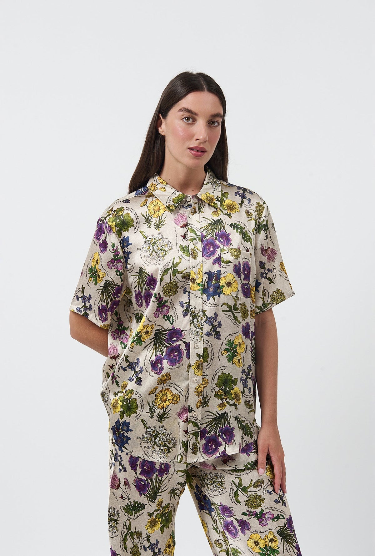 Image of a model wearing Tops. Product name - Short Sleeve Boyfriend Shirt Endangered Flowers in Endangered Flowers colour by brand - Silk Laundry