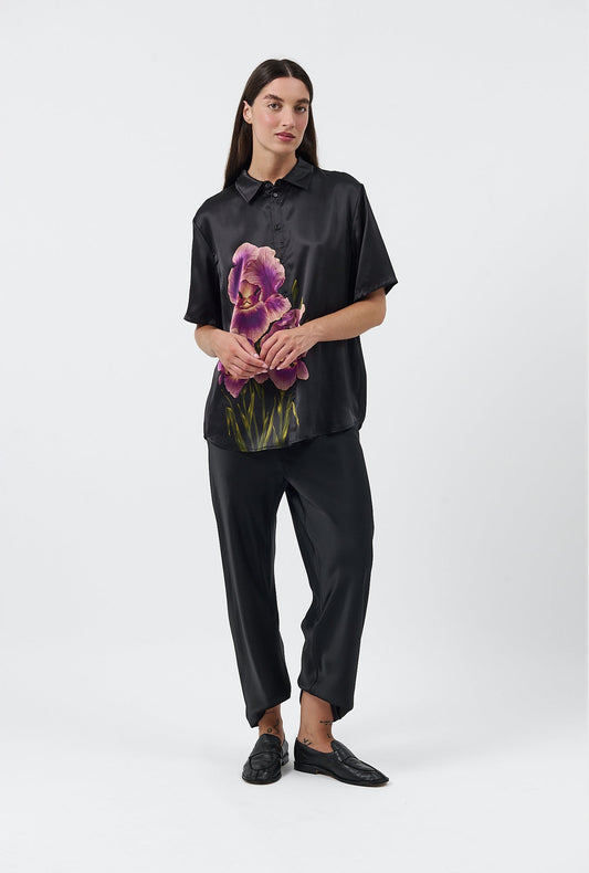 Image of a model wearing Tops. Product name - Short Sleeve Boyfriend Shirt Iris in Iris colour by brand - Silk Laundry