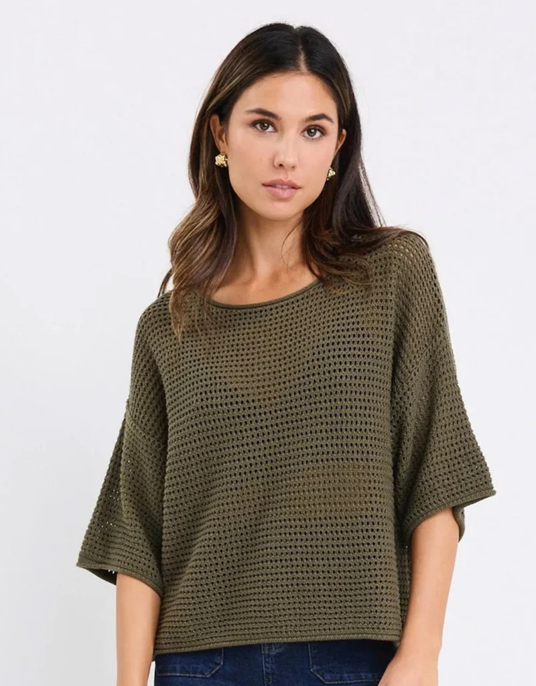 Image of a model wearing Outerwear. Product name - Sunrise Crochet Knit Top Khaki in Khaki colour by brand - Re:Union The Label