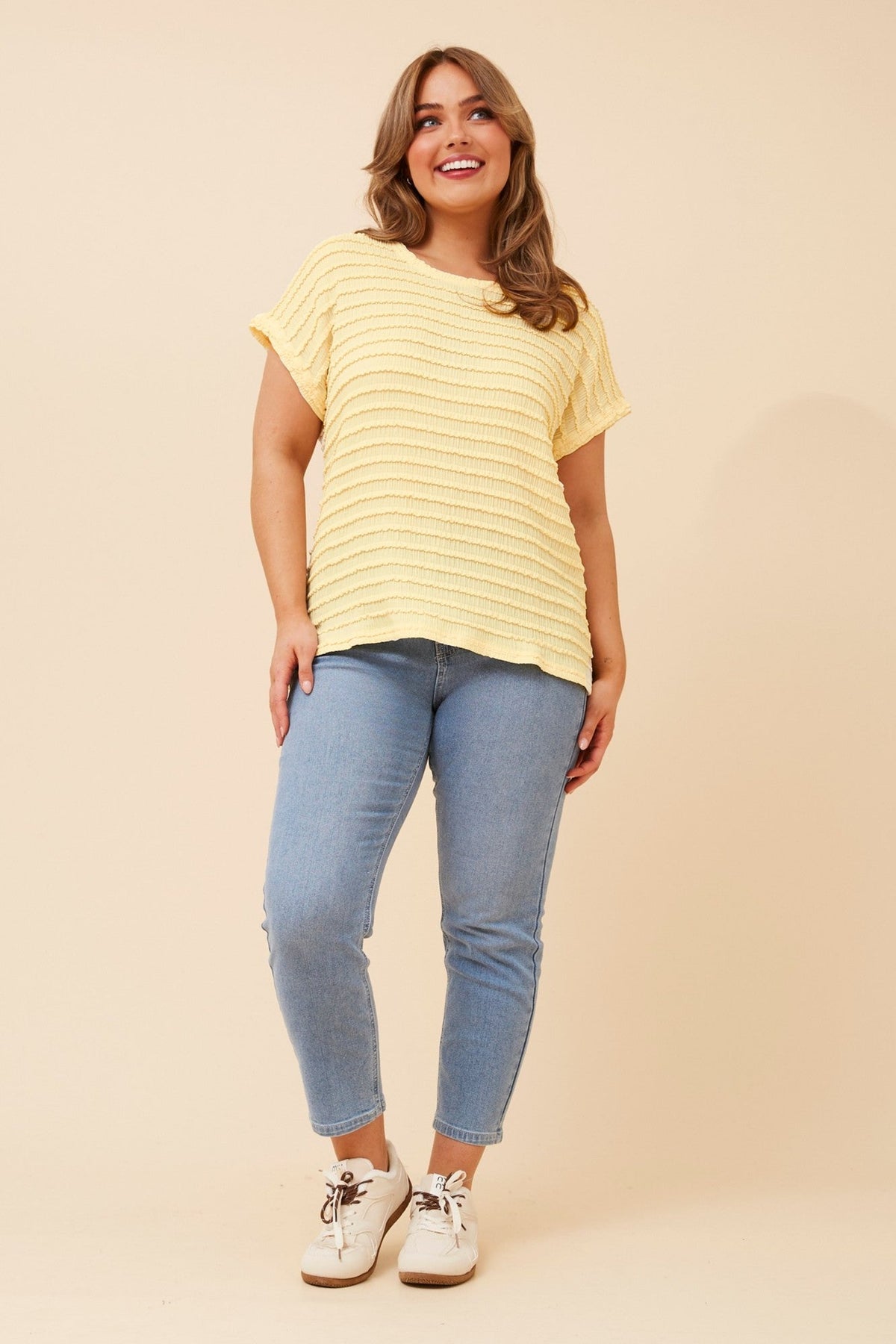 Image of a model wearing Tops. Product name - NAIM SOLID TOP in Black colour by brand - Stella