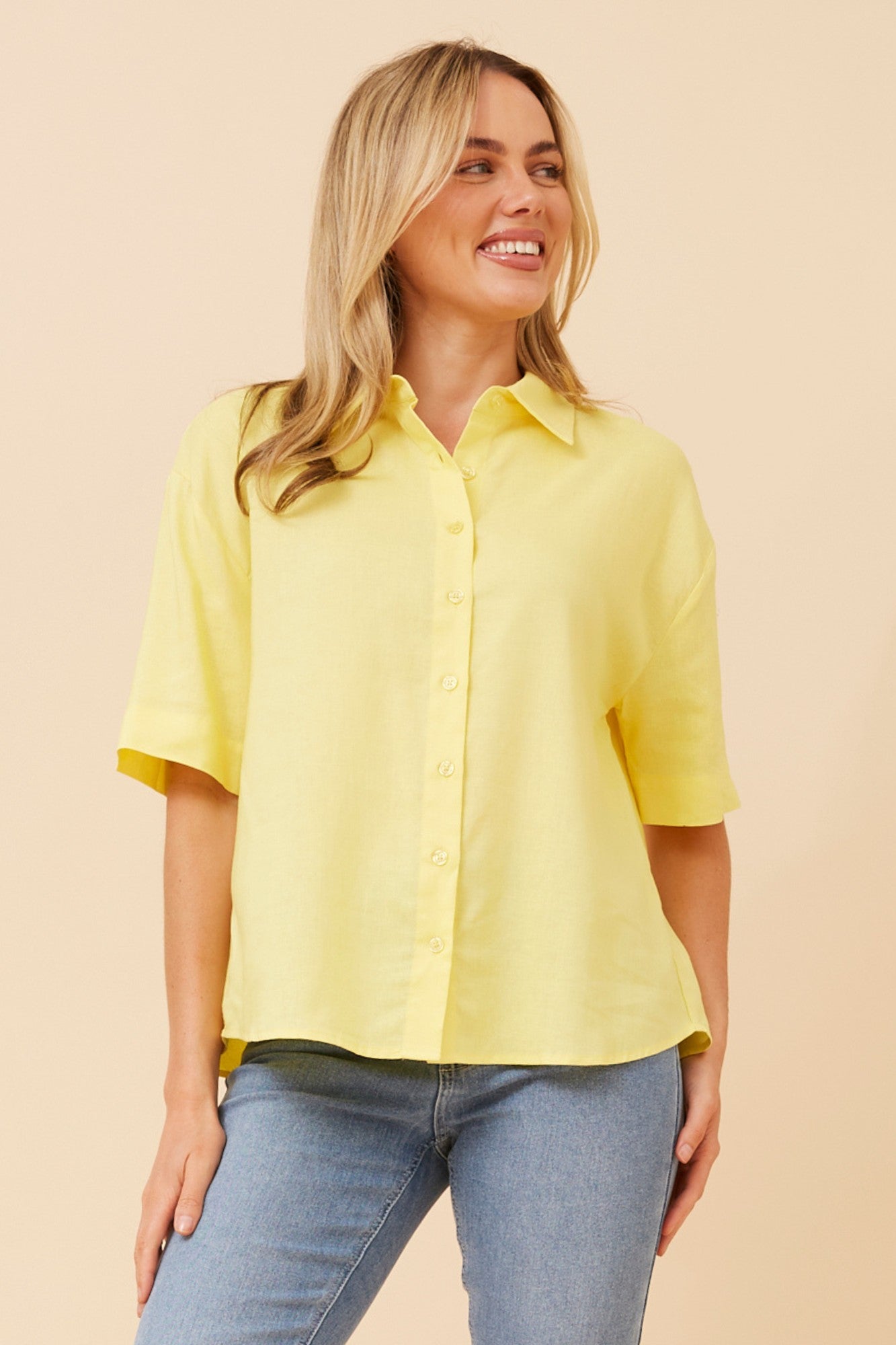 Image of a model wearing Tops. Product name - CALEB LINEN BLEND TOP in Skylight colour by brand - Caroline Morgan Australia