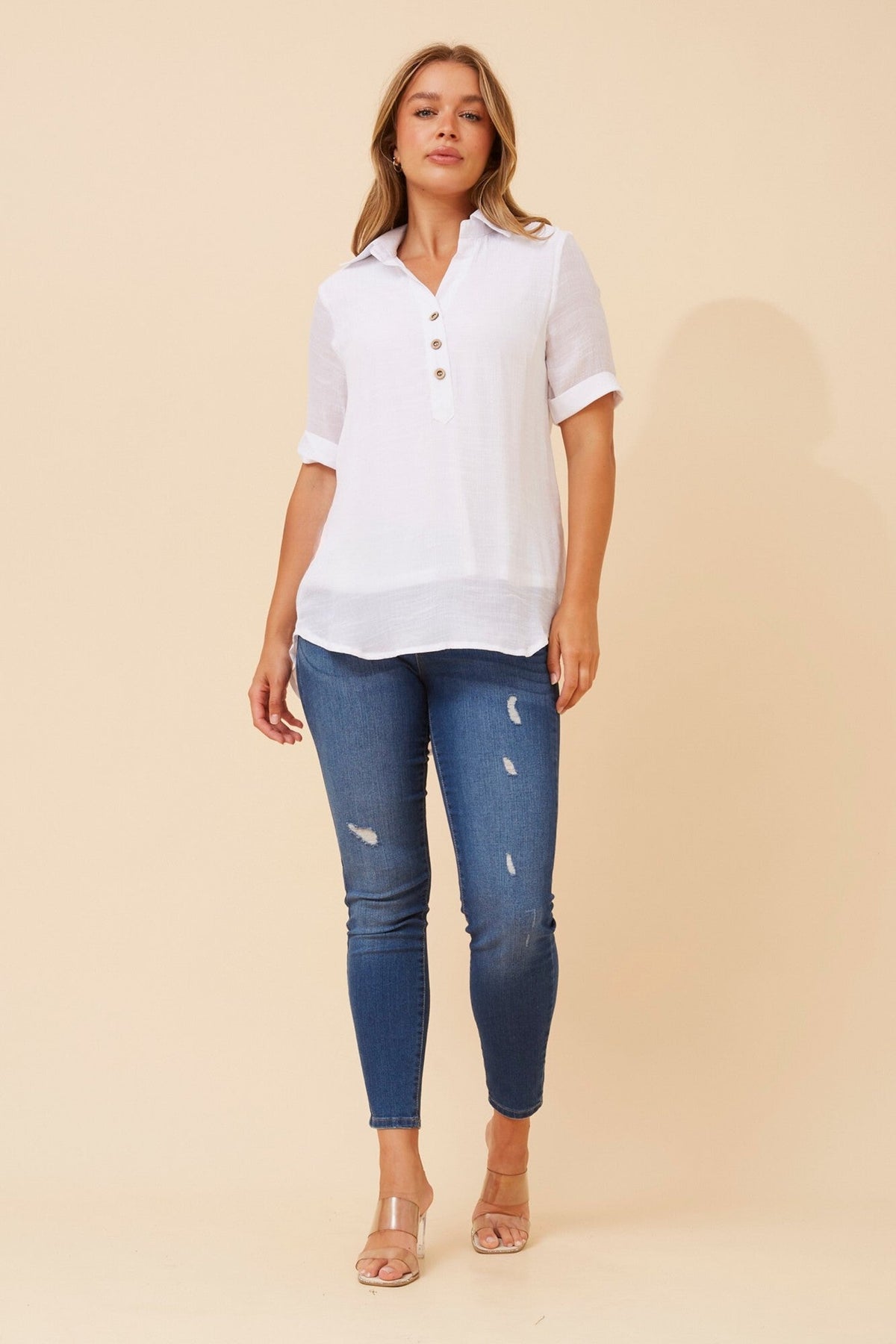 Image of a model wearing Tops. Product name - IRINI SOLID TOP in White colour by brand - Caroline Morgan Australia