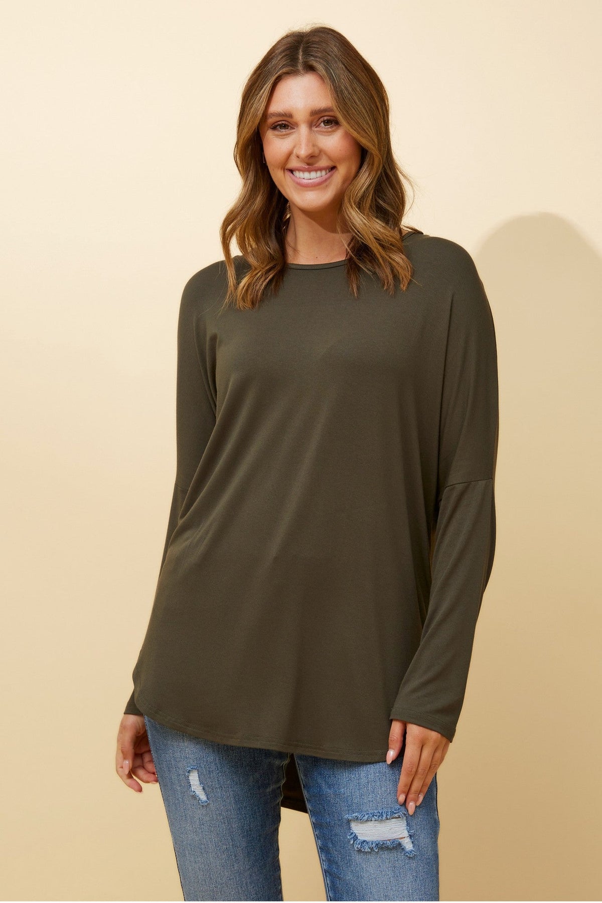 Image of a model wearing Tops. Product name - SKYE SOLID TOP in Khaki colour by brand - Caroline Morgan Australia