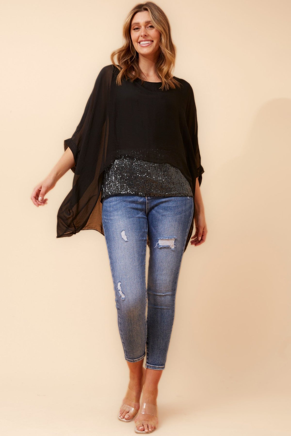 Image of a model wearing Tops. Product name - ARGLE SILK BLEND SEQUIN TOP in Ivory colour by brand - BOTTEGA MODA