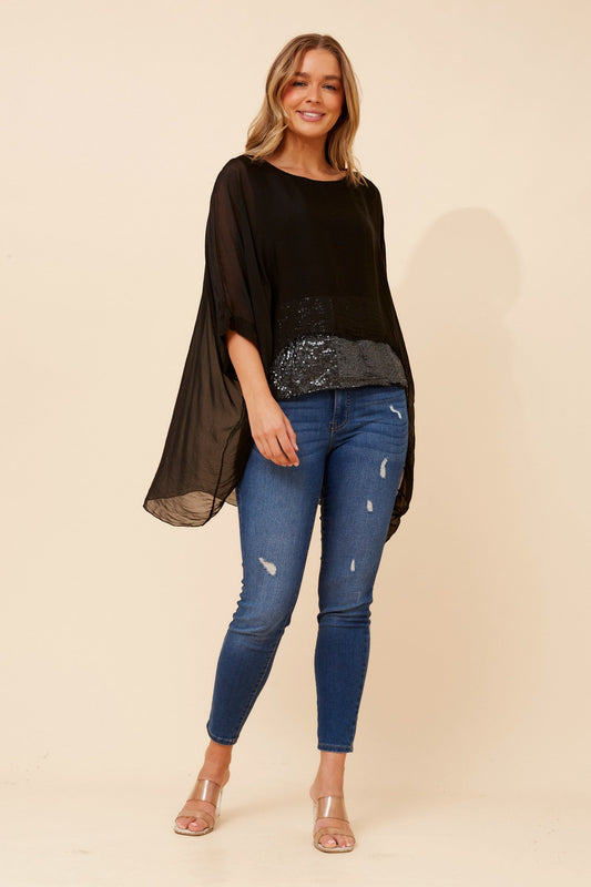 Image of a model wearing Tops. Product name - ARGLE SILK BLEND SEQUIN TOP in Ivory colour by brand - BOTTEGA MODA