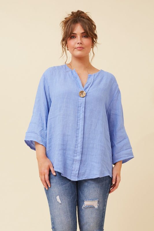 Image of a model wearing Tops. Product name - PALERMO LINEN TOP in Light Denim colour by brand - BOTTEGA MODA